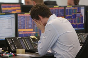 Trader With his head in his hands